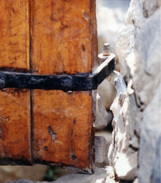 A metal hinge on a door or gate