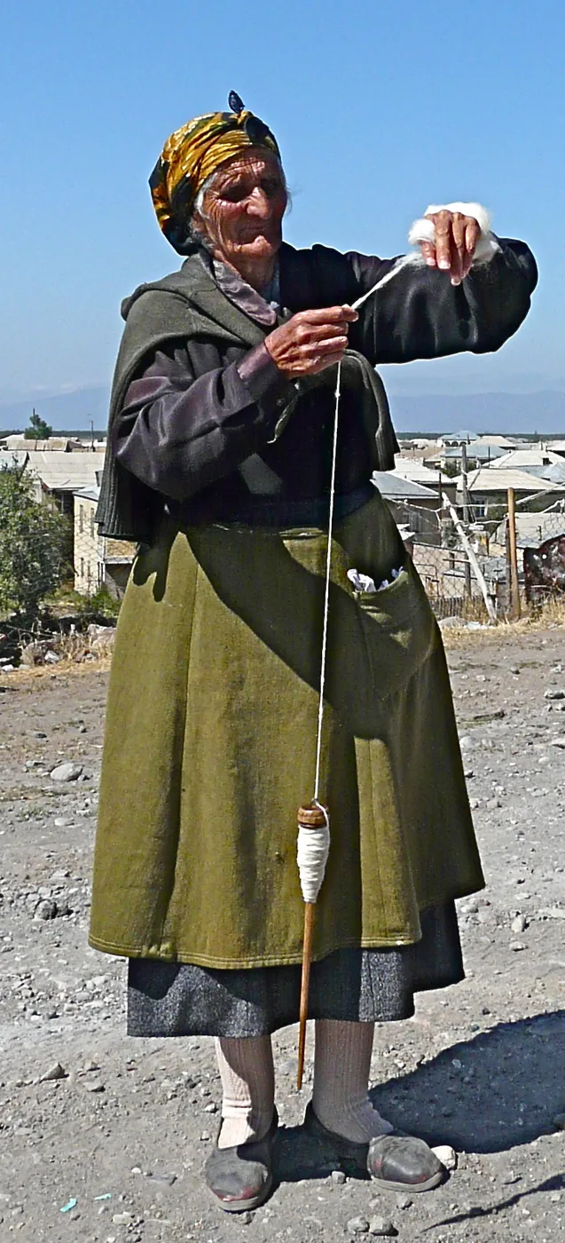Woman using a spindle