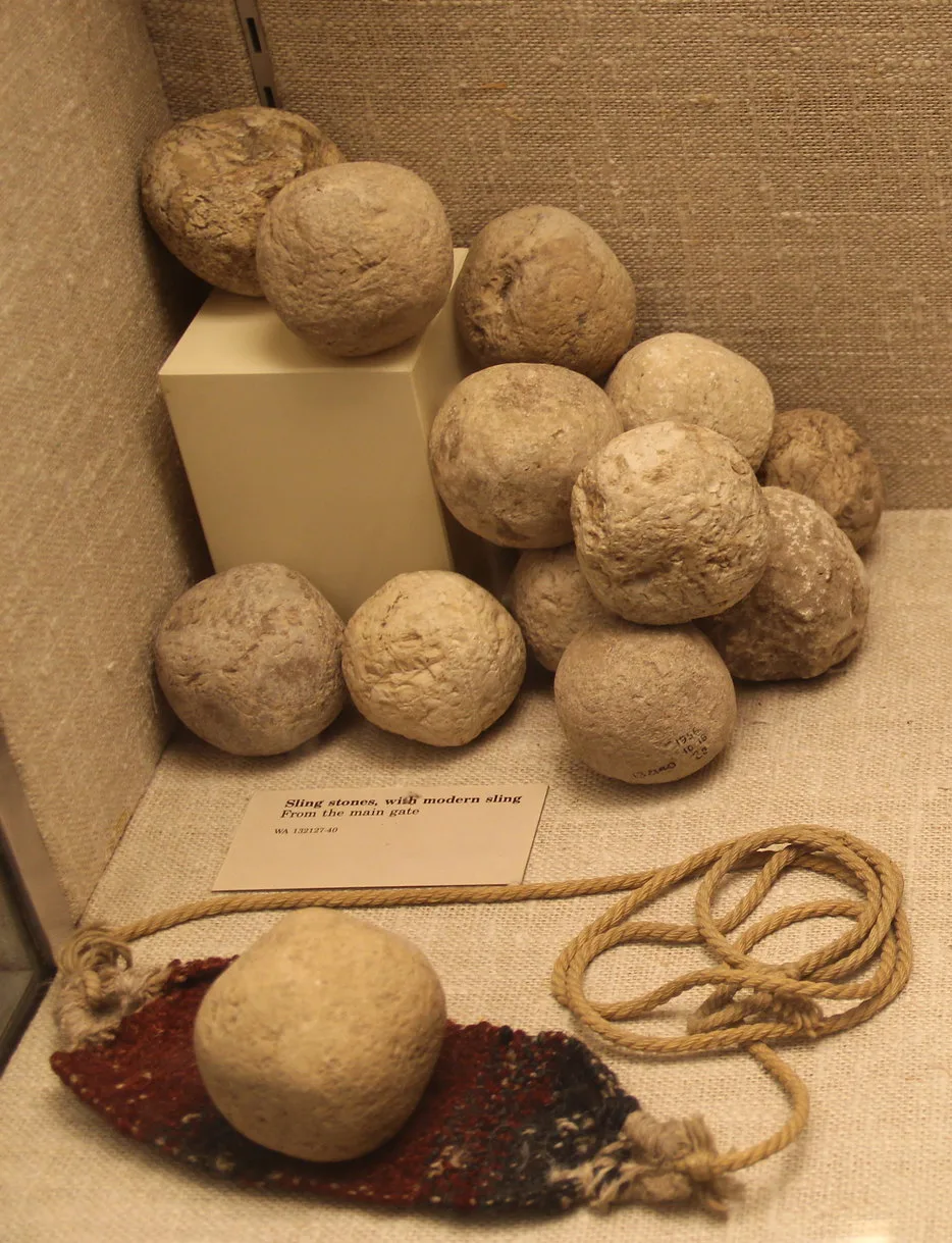 A sling with rounded sling stones (Assyrian Gallery, British Museum)