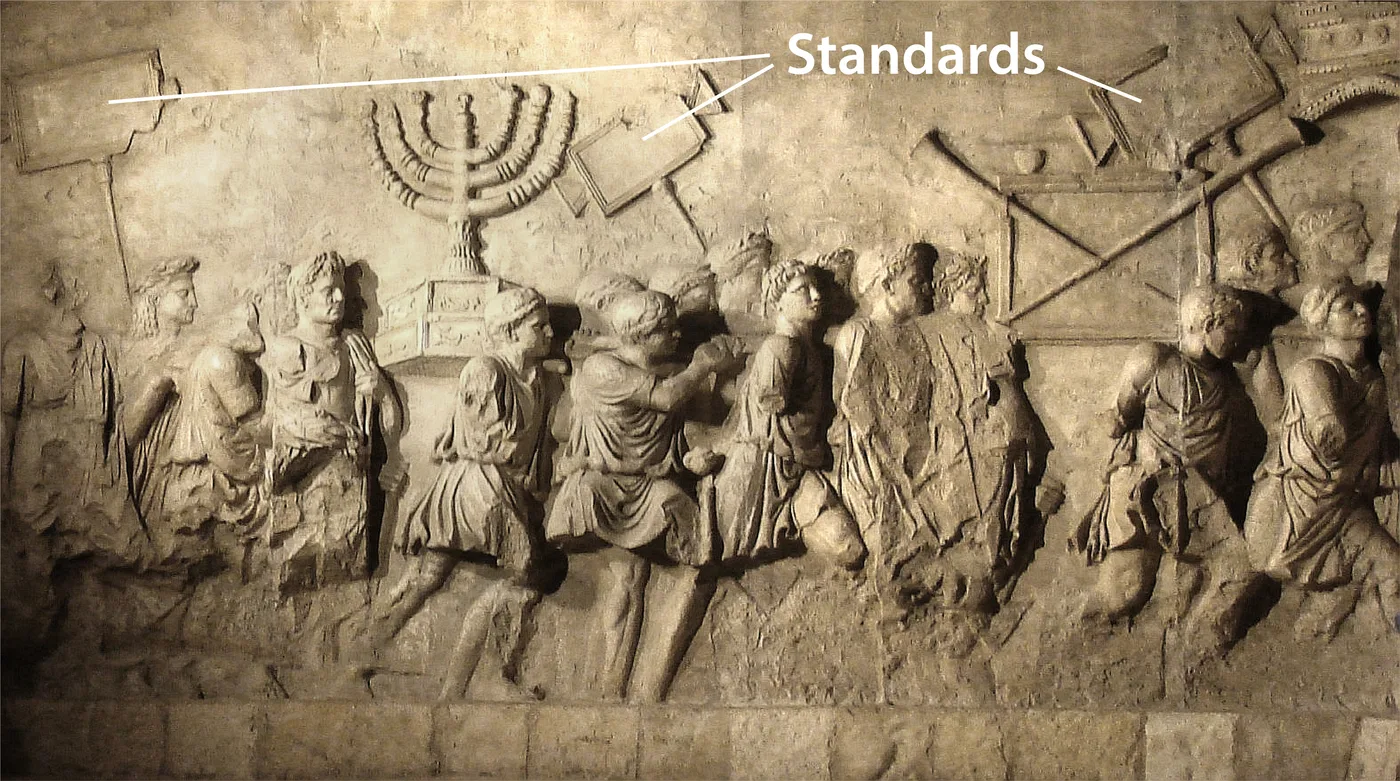 Reconstruction of the Titus Arch frieze (Rome), showing a menorah and standards from the temple being carried off by the Roman victors (71 C.E.)
