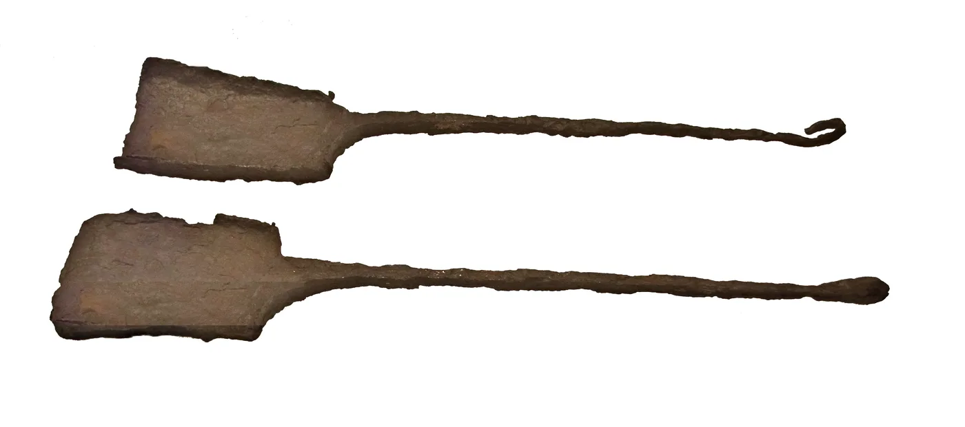 Large shovels to remove refuse from the altar