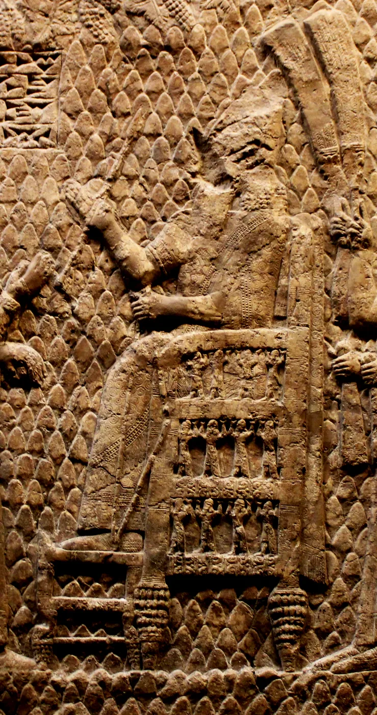 King seated with his feet on a footstool (Lachish relief)