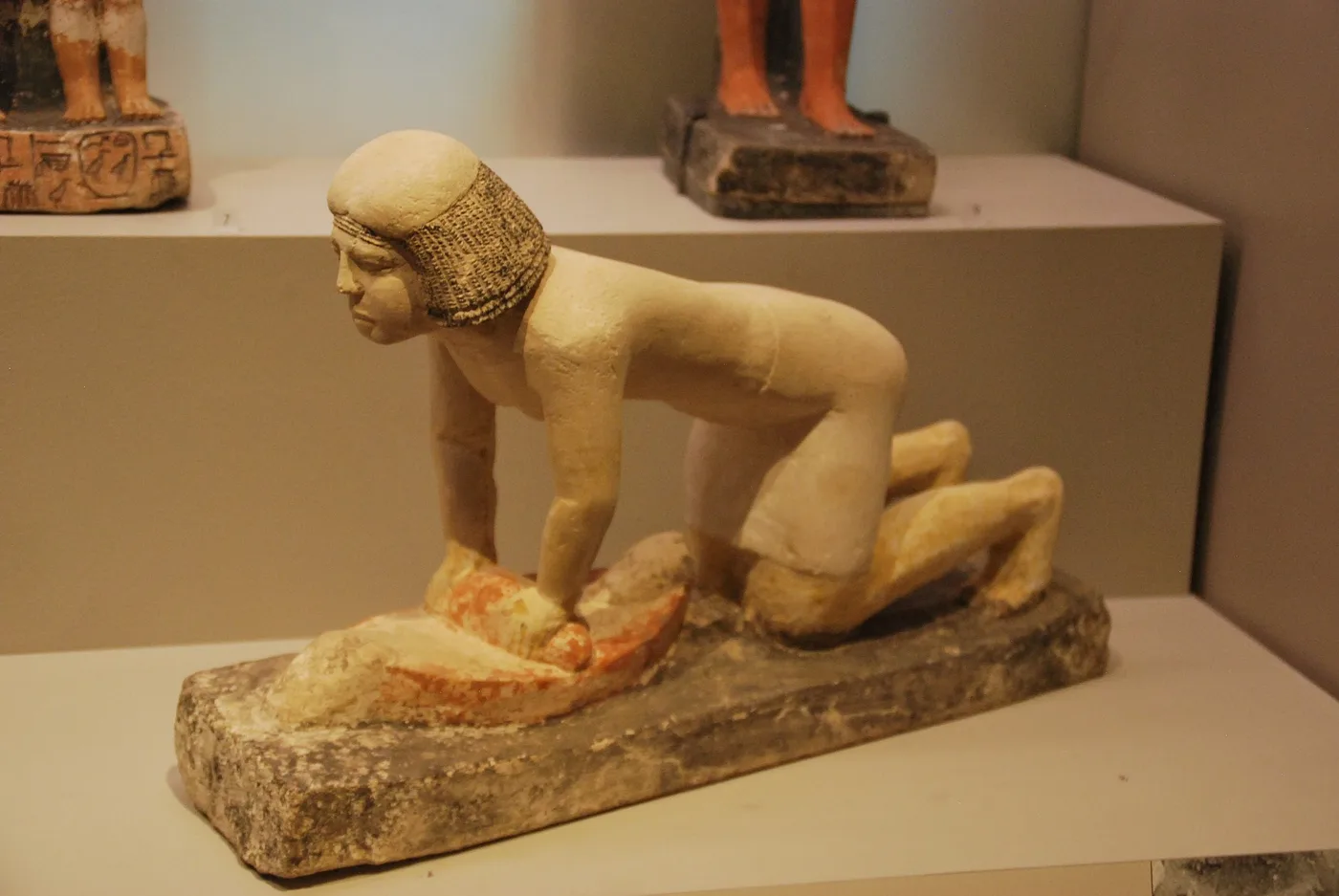 Woman grinding with a handmill