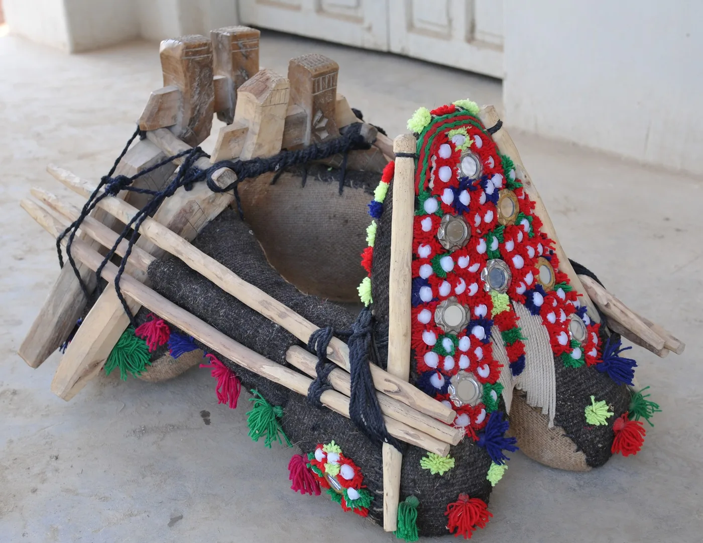This frame allow the rider to sit on the camel