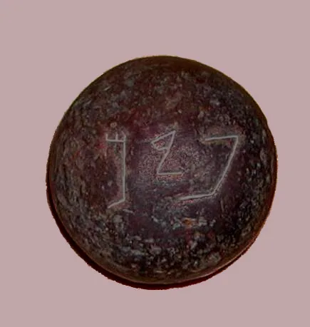 This stone weight has its name, 'pim', inscribed on it in ancient Hebrew letters