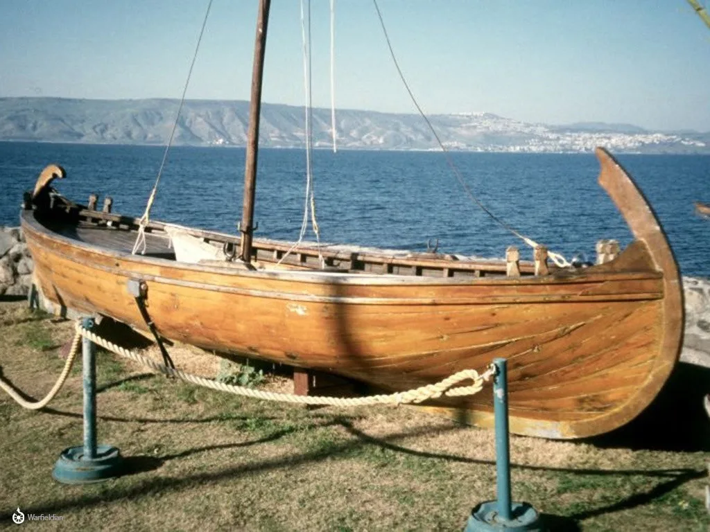 Fishermen in a boat with furled sail